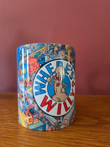 A mug featuring a cartoon character and the text "Where's Willy?" on a colourful background.